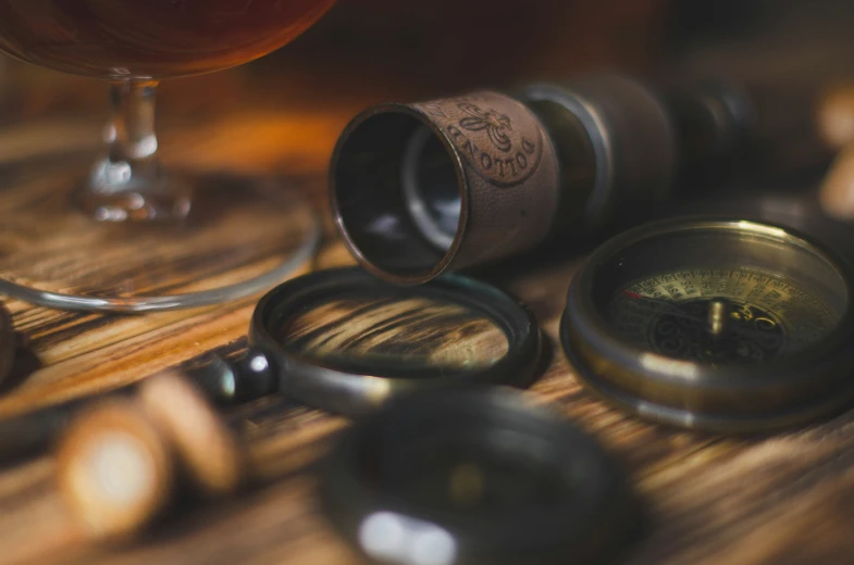 closeup of old wine corks and an empty glass