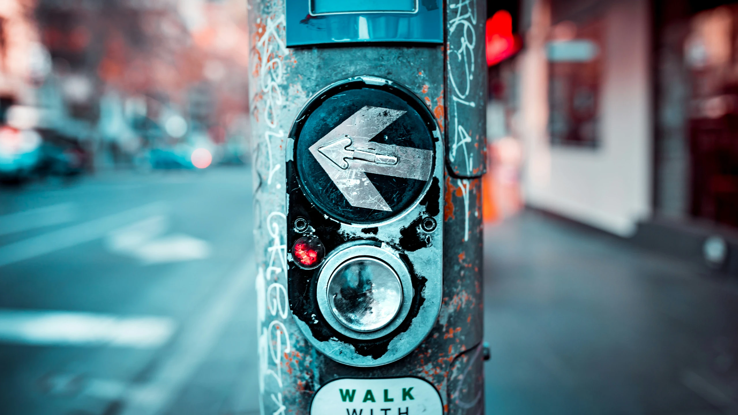 a red light with white and blue signs on it