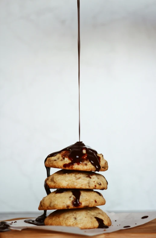 there is a stack of cookies that has a drizzled chocolate