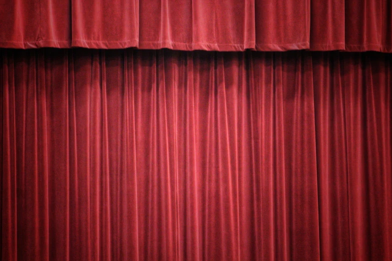 the curtain is open in an empty theatre