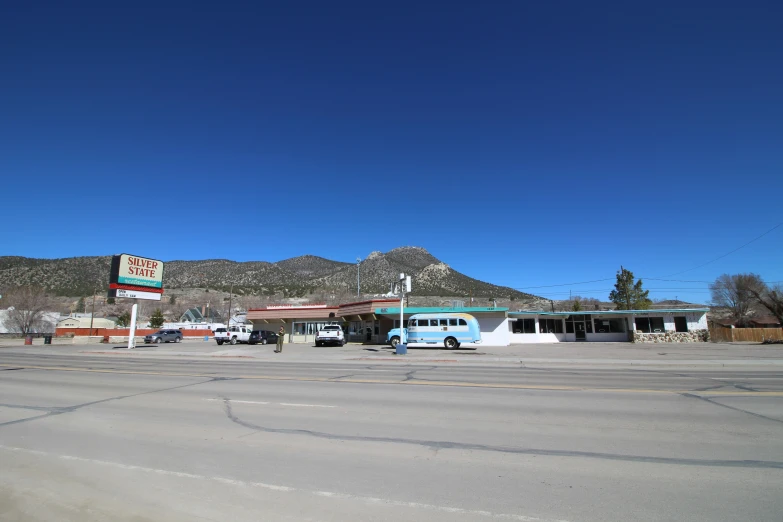 a bus parked in front of a gas station