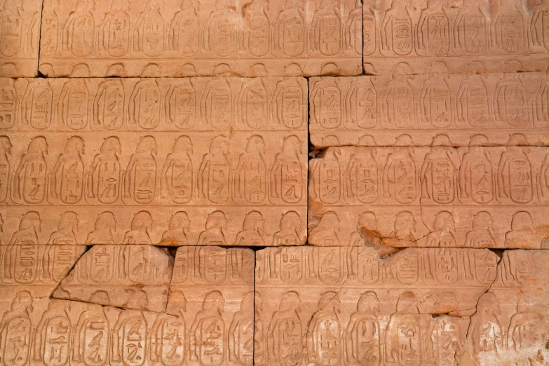 many carvings at the top of a wall in a building