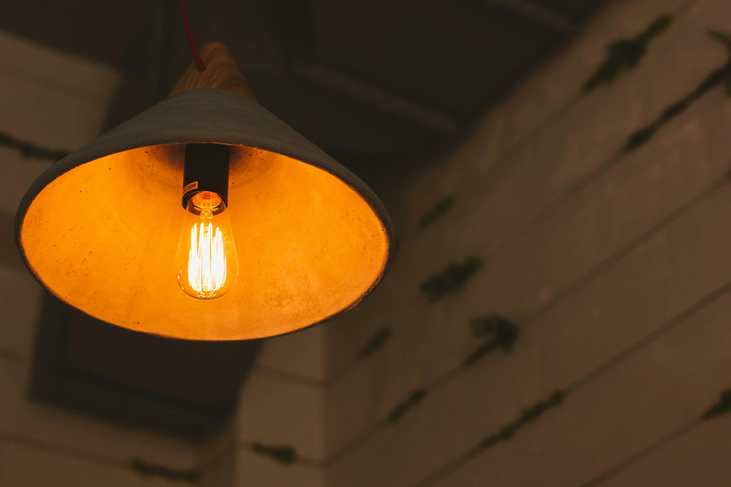 an old light hanging in the middle of a room