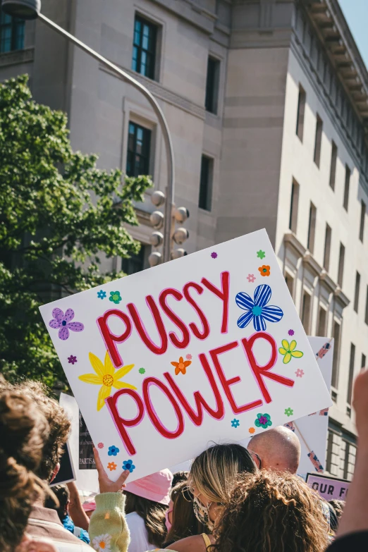 a person holding up a sign that says sy power