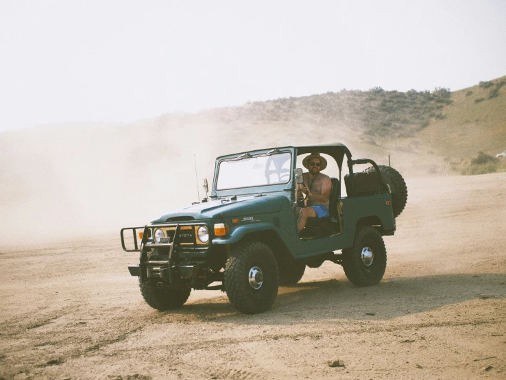 a man riding on the back of an open pick up truck