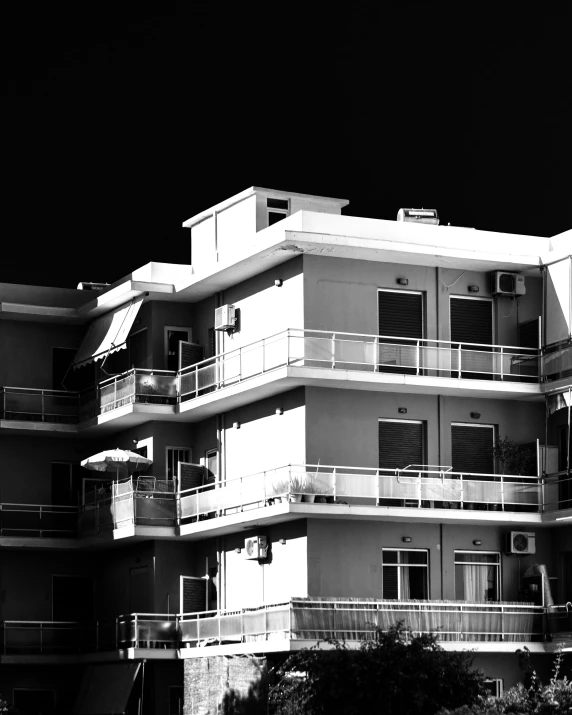 an apartment building is shown with balconies and balconies on it