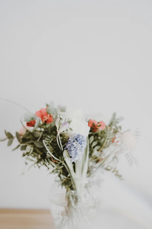 flowers in a vase on top of a table