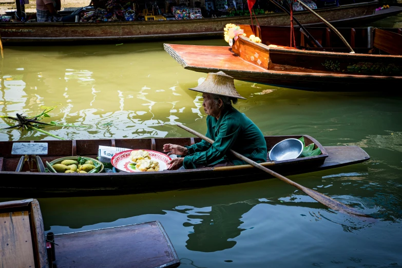 a person on a small boat in the water