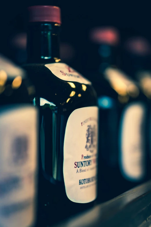 a bottle of suntory sitting on a shelf