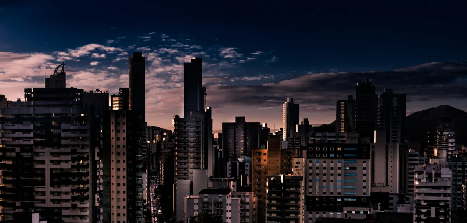 a large city at night with lots of tall buildings