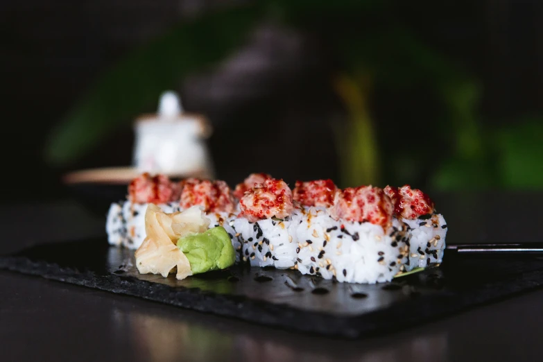 a sushi is displayed on a square plate