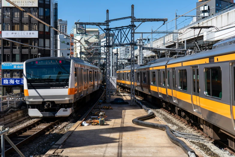 two trains on train tracks beside each other