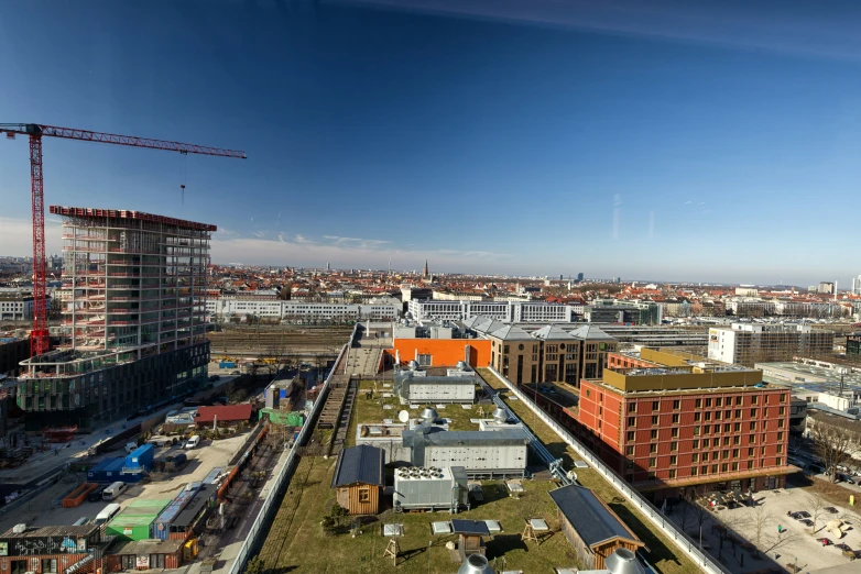 aerial view of city with large construction and construction machinery