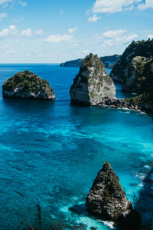 the beach and rocks are blue, calm and tropical