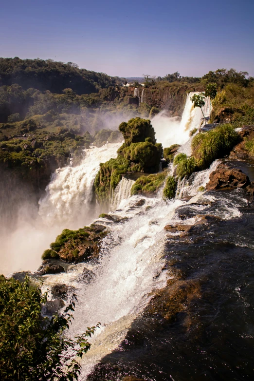 a large waterfall with lots of water coming out of it