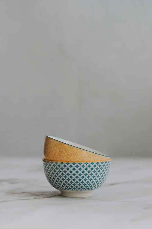 a white bowl with a yellow band around the side