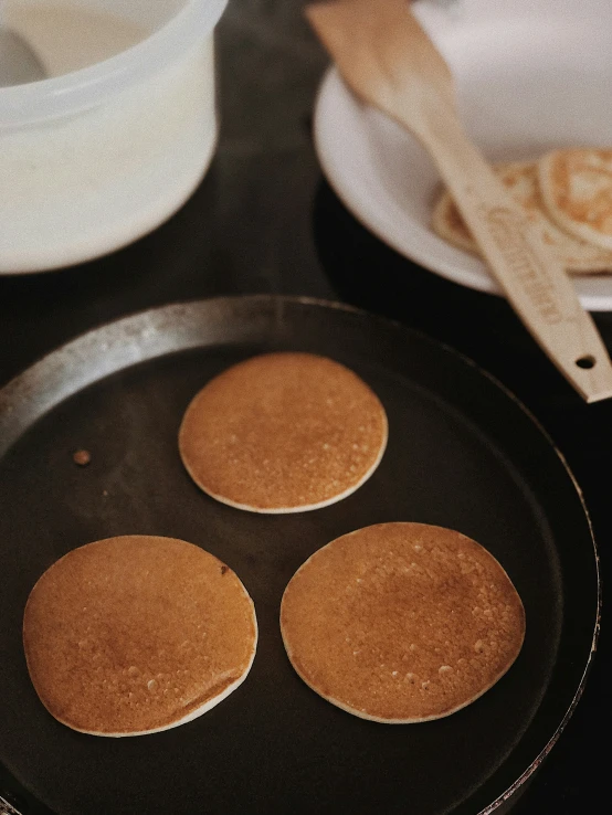 a pan of pancakes sitting on top of a stove