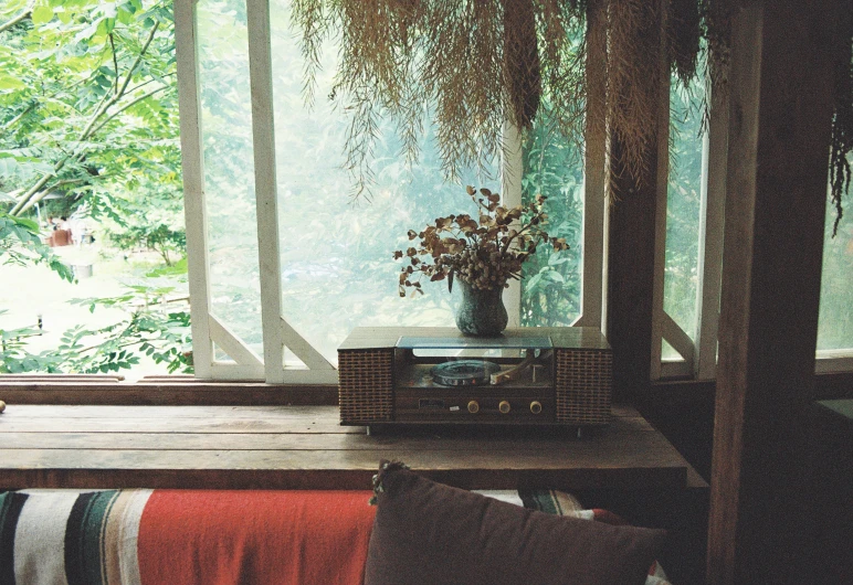 a vase sitting on top of a wooden table