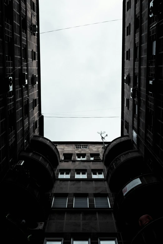 view from the top looking up at tall buildings