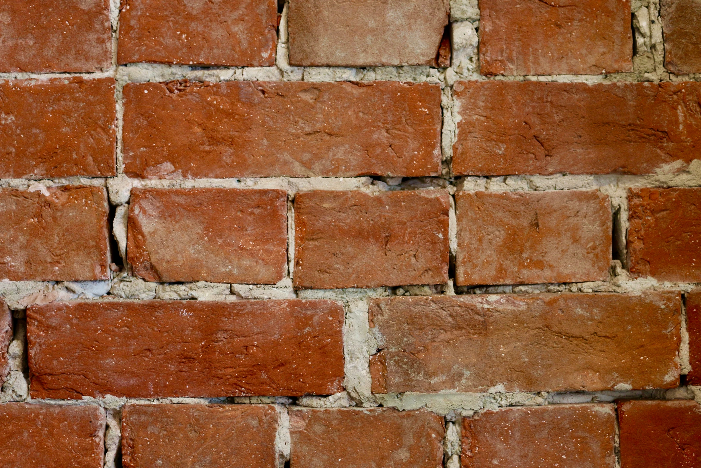 the wall made out of bricks with lots of brown bricks