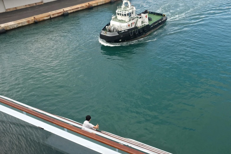 a ferry moves alongside the port docks near the pier