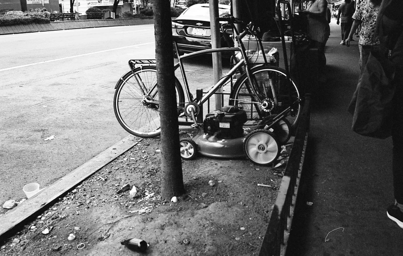 a bike is leaning up against a pole