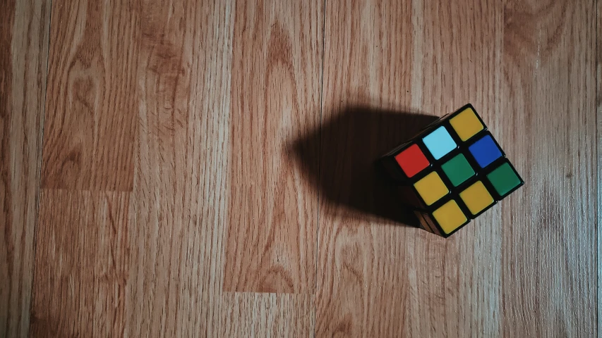 an odd shape rubik cube on the floor