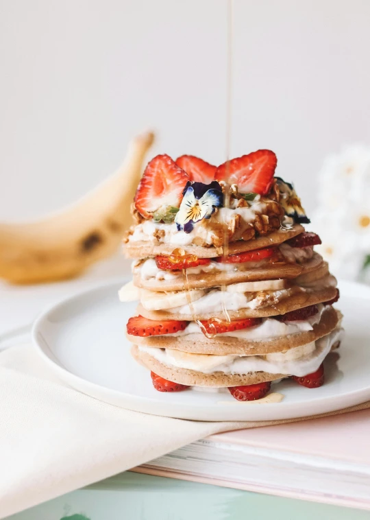 food is piled high on top of a plate