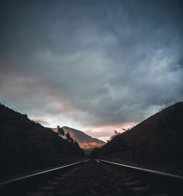 a black and white pograph of the train tracks