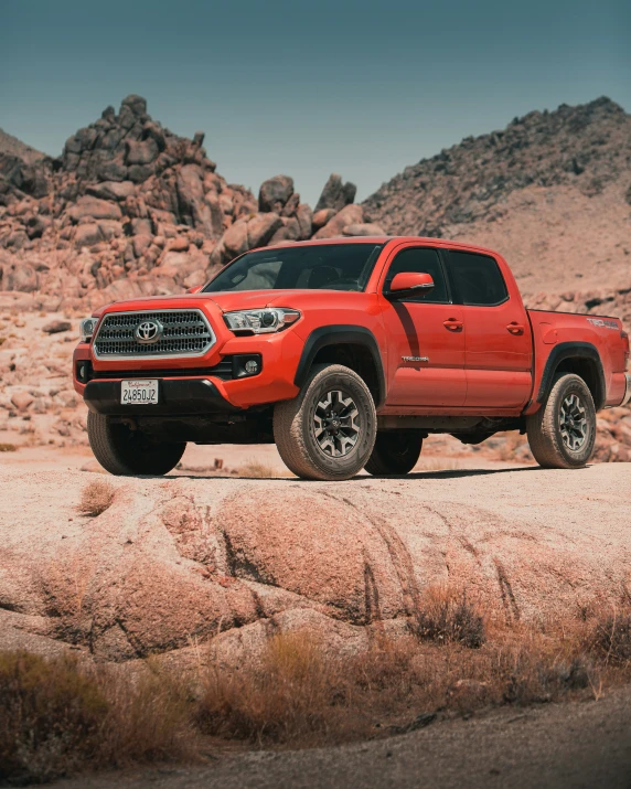 a red toyota tundra on a desert plain