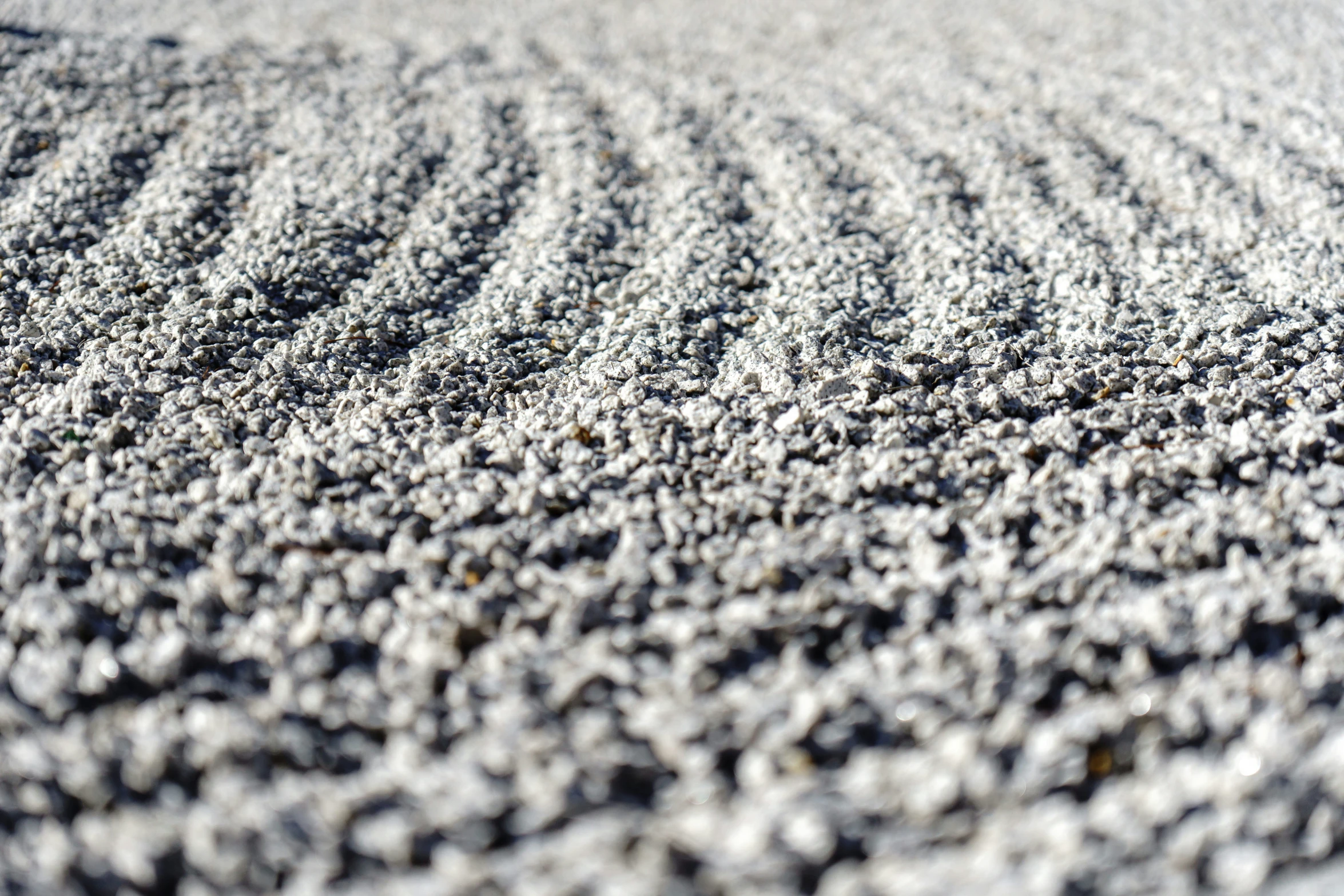 a view of gray carpet and a red object