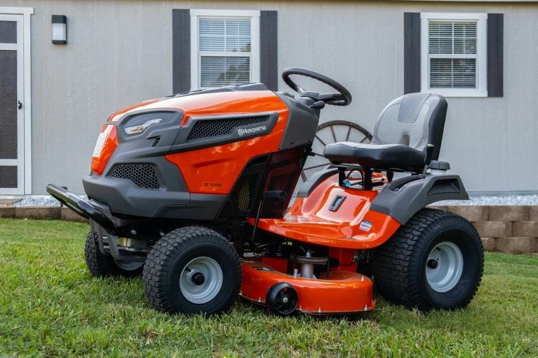 a lawn mower sitting on top of the grass