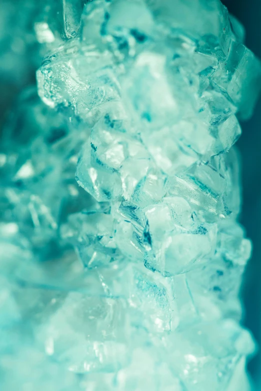 ice crystals on blue surface with some small bubbles