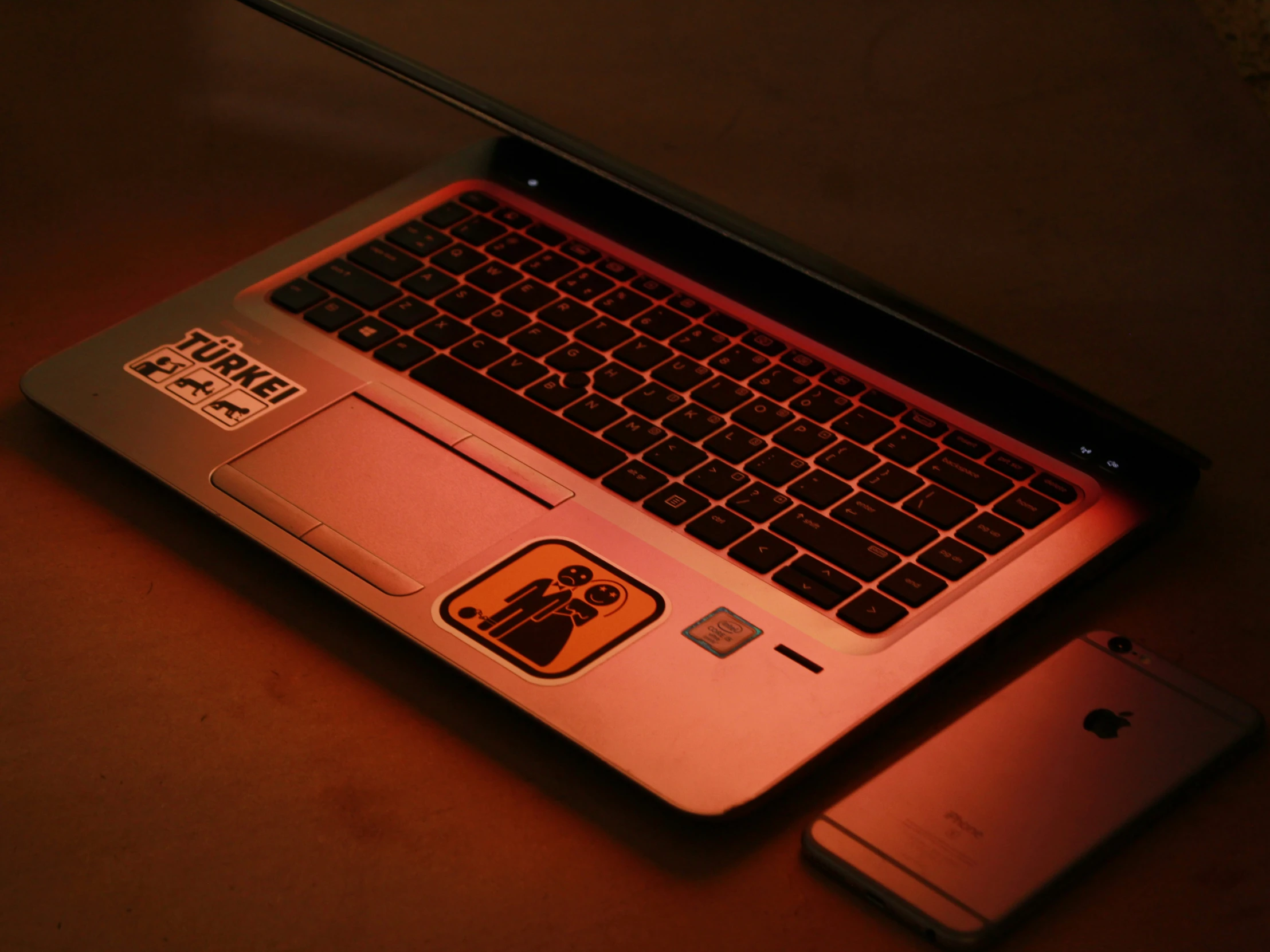 an open laptop computer sitting on top of a table