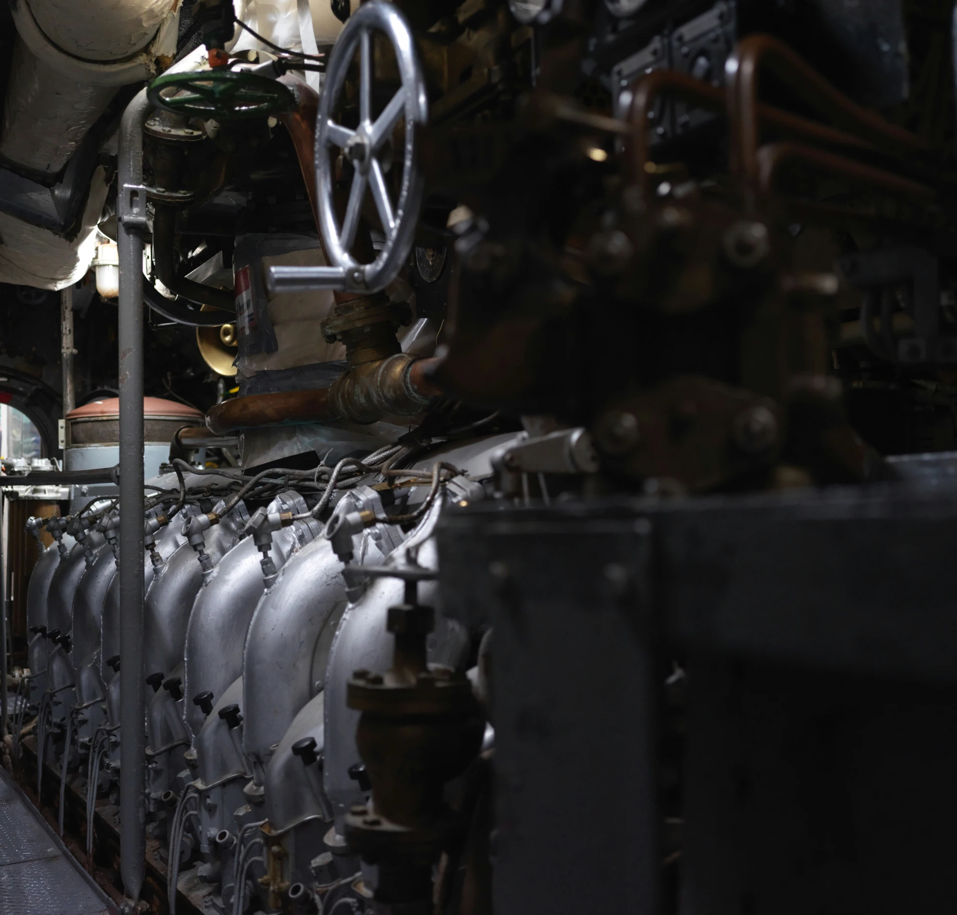 engine of ship on floor near lamp with exposed light