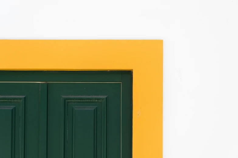 a yellow and green door is in an outdoor room