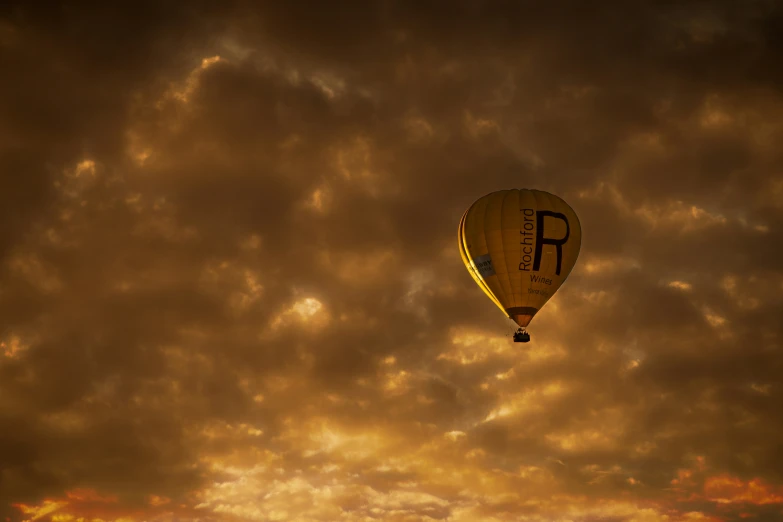 a balloon in the sky during sunset or sunrise