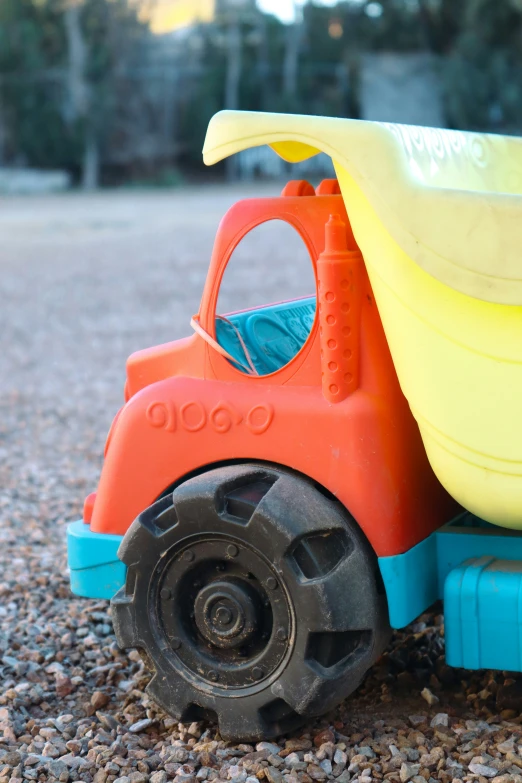 toy dumper with a plastic fork on the side of it