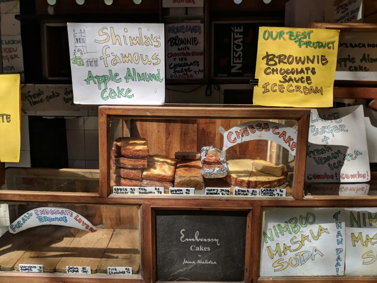 signs are posted in wood to help sell their bread