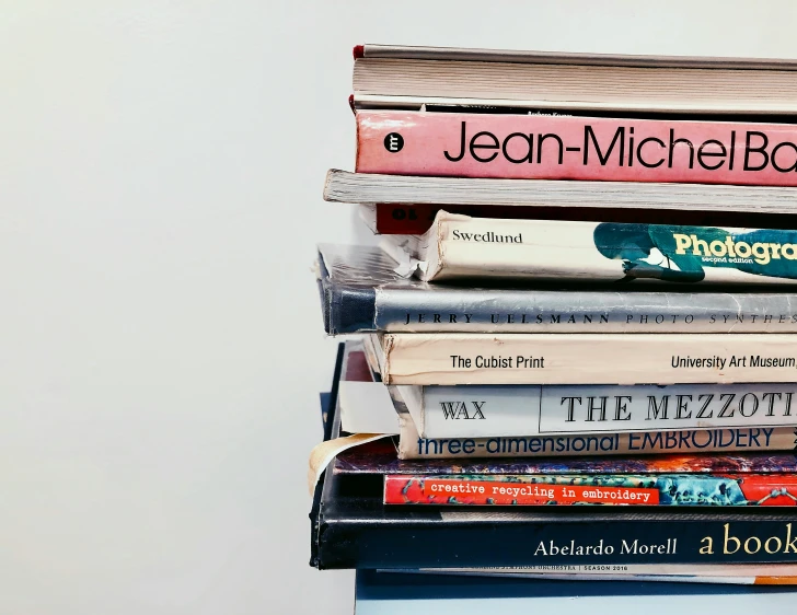 stack of different books sitting on top of each other