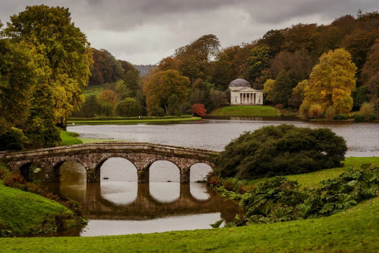 an image of a bridge that goes across a lake