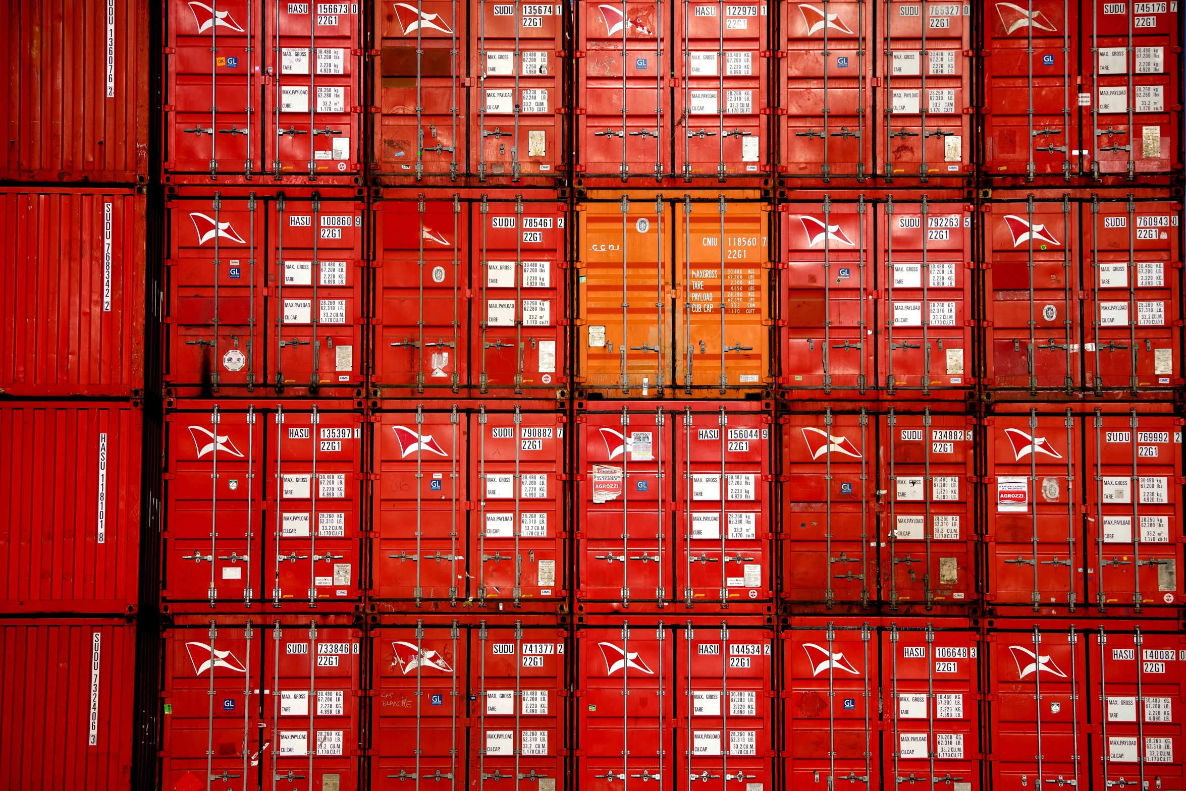 many red containers stacked together with numbers on them