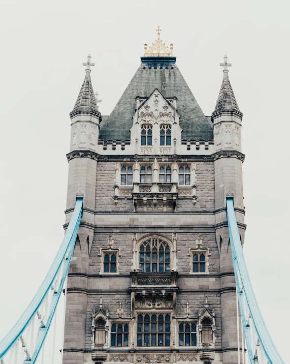 a bridge with towers and two clock built over it