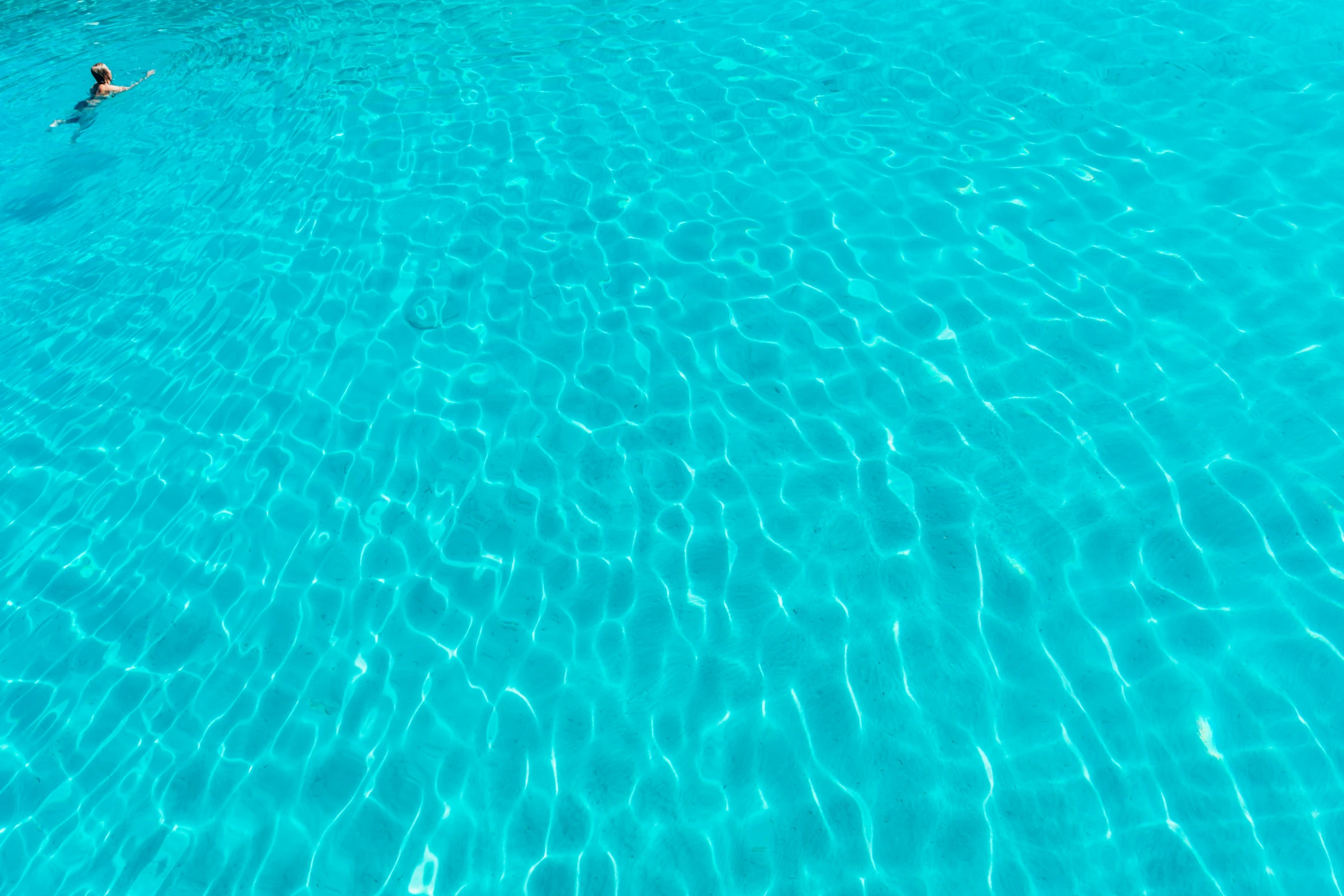 an aerial s of two people in a pool