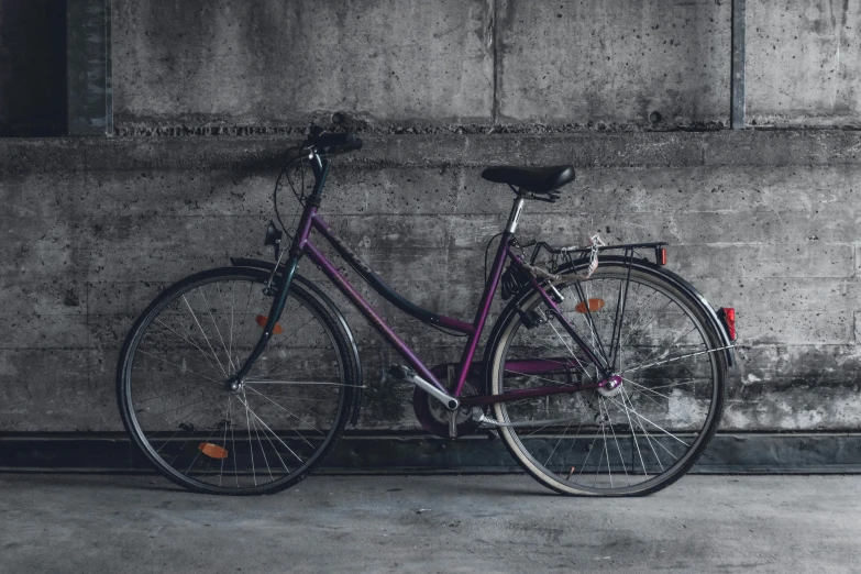 bicycle parked in the middle of an empty room