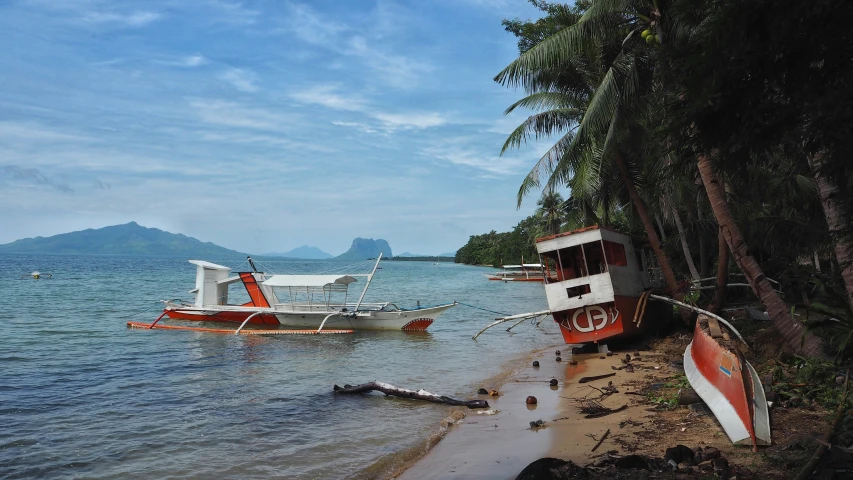 a boat on the water next to shore