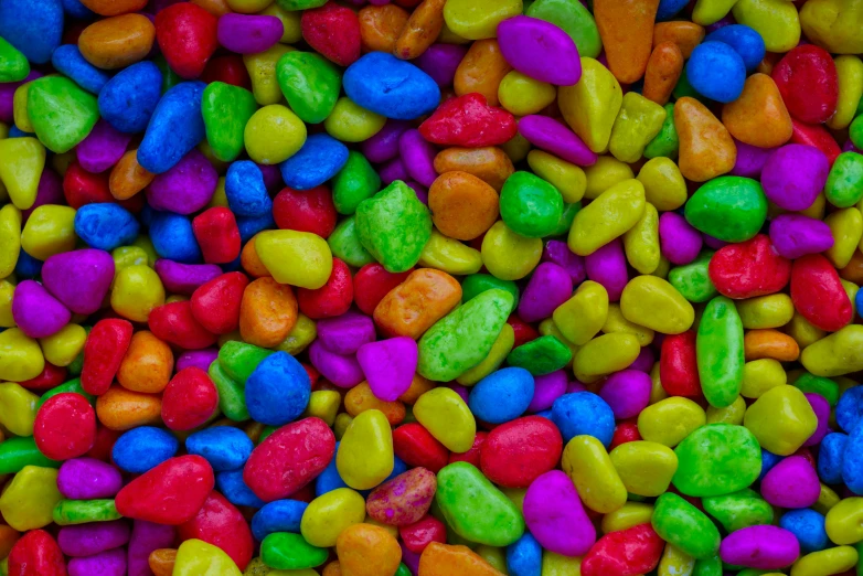 a large pile of multi colored candy rocks