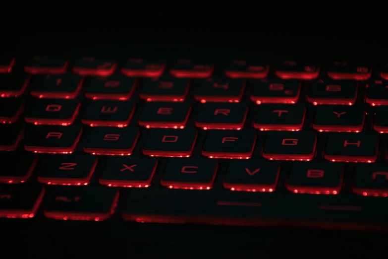 a black background shows a glowing keyboard in red lighting