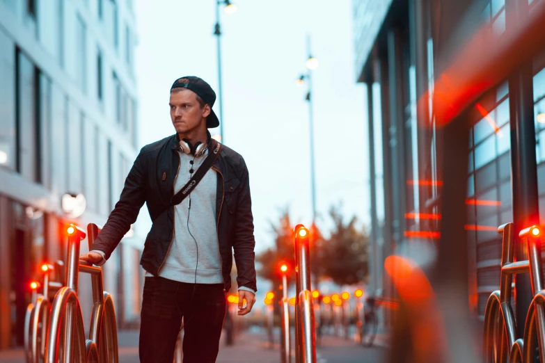 a man walks down the street on his bicycle