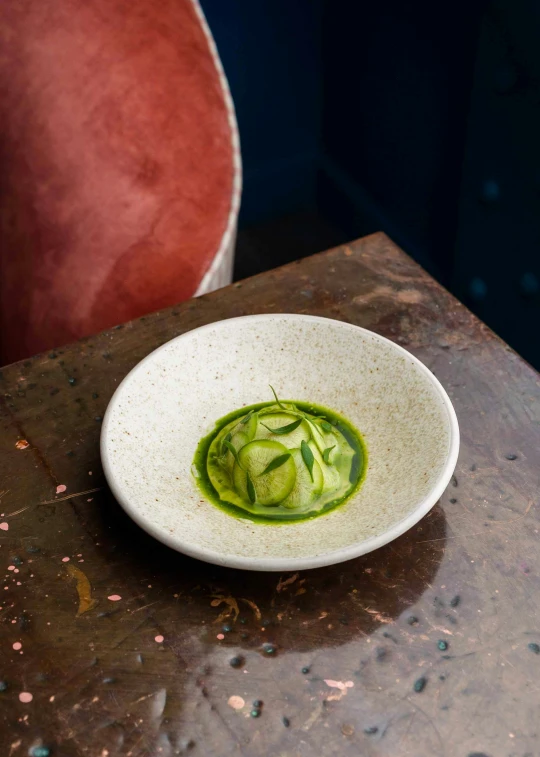 a small bowl with a green vegetable dish